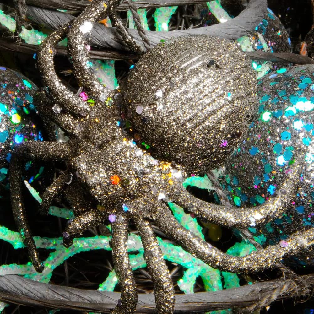 National Tree Company 23 in. Potted Halloween Tree with Sequined Leaves and Spiders
