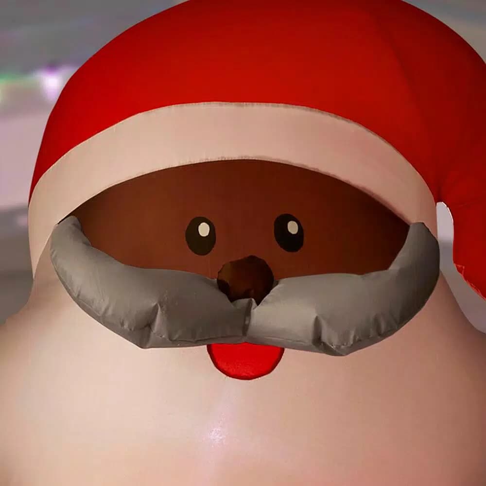 Home Accents Holiday Gemmy Airblown 6.5 ft. LED Outdoor Inflatable African-American Santa with Present