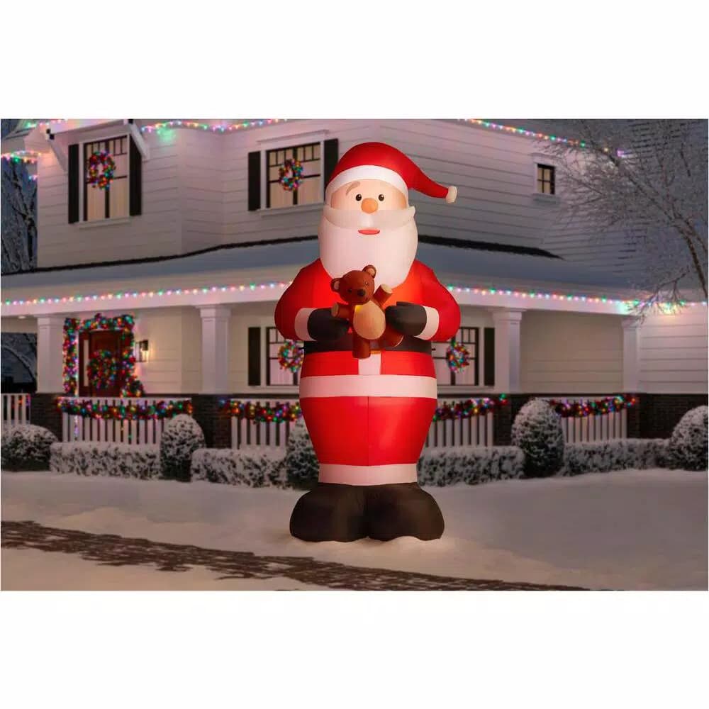 Home Accents Holiday Gemmy Industries 12 ft. Giant Inflatable Santa with LED Lights and Candy Cane