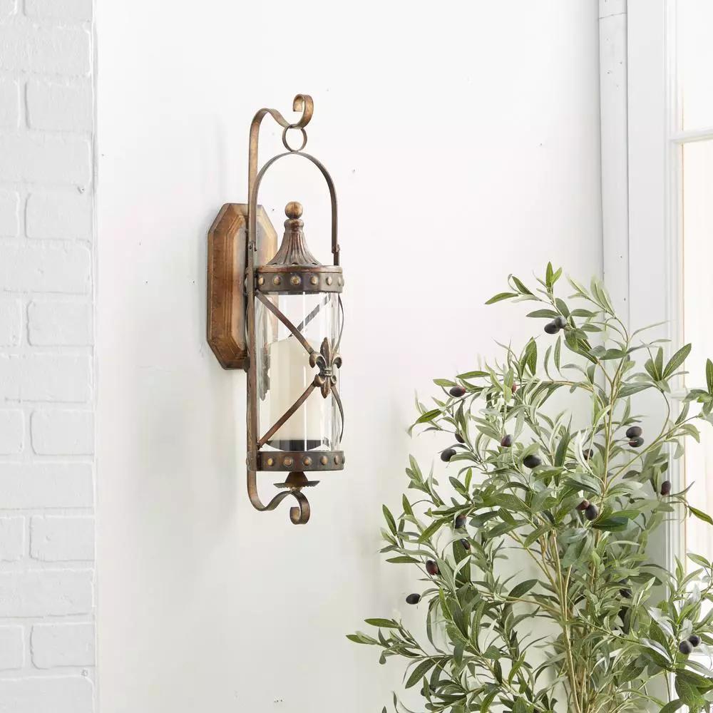 LITTON LANE Old World Riveted Burnished Bronze Iron Candle Sconce with Fleur-de-lis Motif