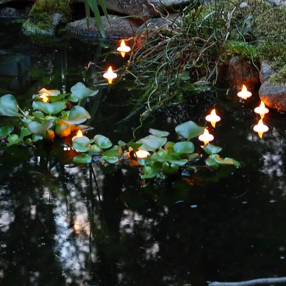 LUMABASE Amber Floating LED Tea Light Candles, Waterproof Battery Operated, 1.25 x 1.25 in, 12-Count