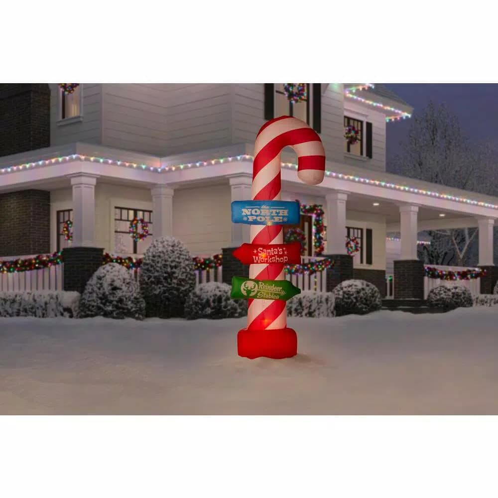 Airblown 8 ft. Inflatable Candy Cane with Directional Stacking Signs Holiday Decoration