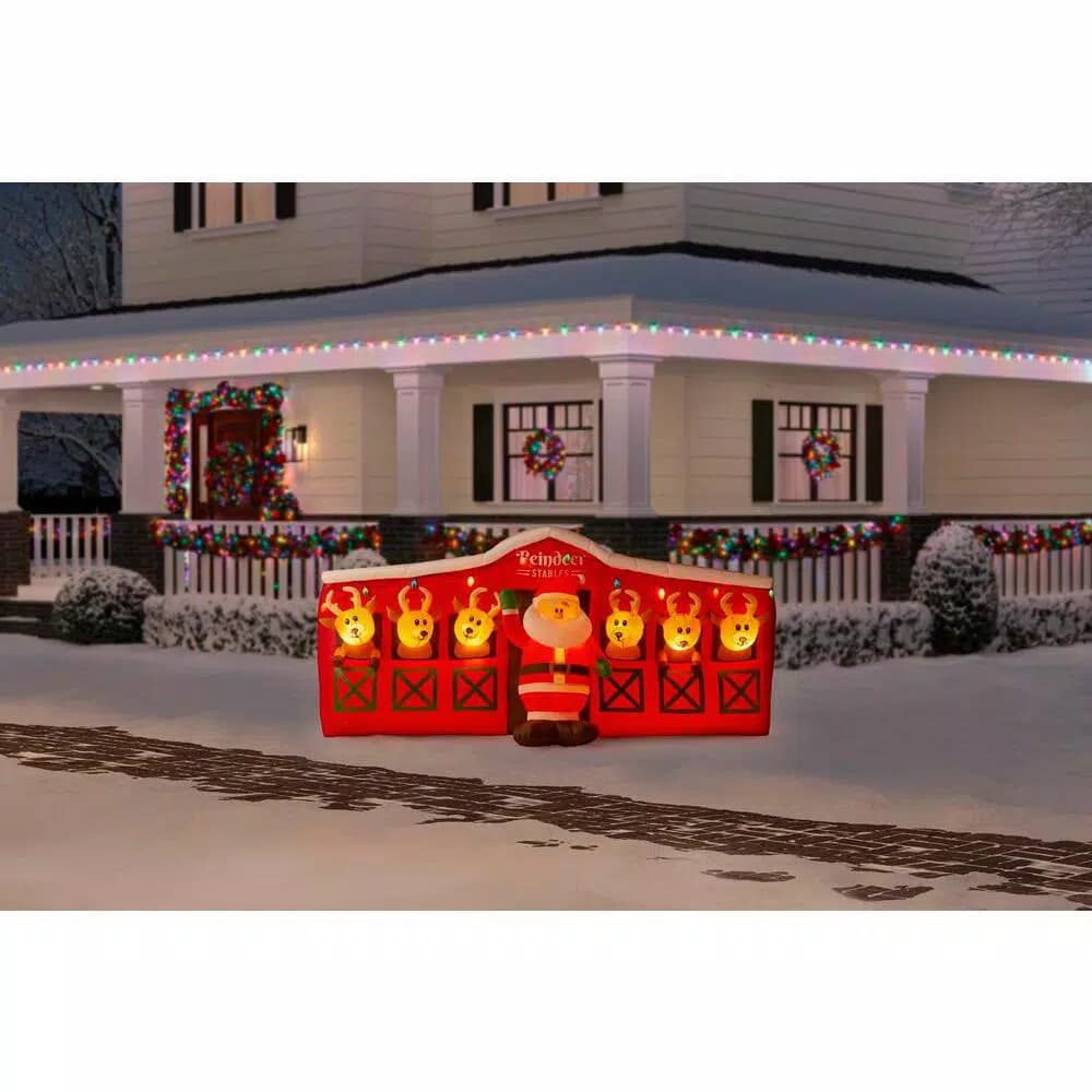 Home Accents Holiday 9 ft LED Inflatable Santa's Stable with Reindeer Holiday Decor