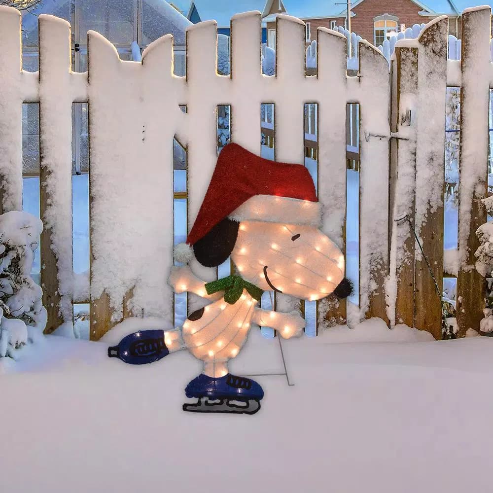 Peanuts 32 in. Peanuts Snoopy Skating 2D LED Pre-Lit Yard Art Christmas Decoration
