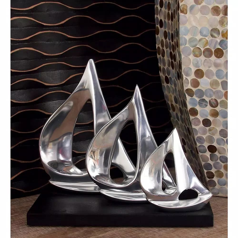 LITTON LANE 9 in. Stylized Sailboat Decorative Sculpture - Polished Silver Aluminum on Black Wood Base