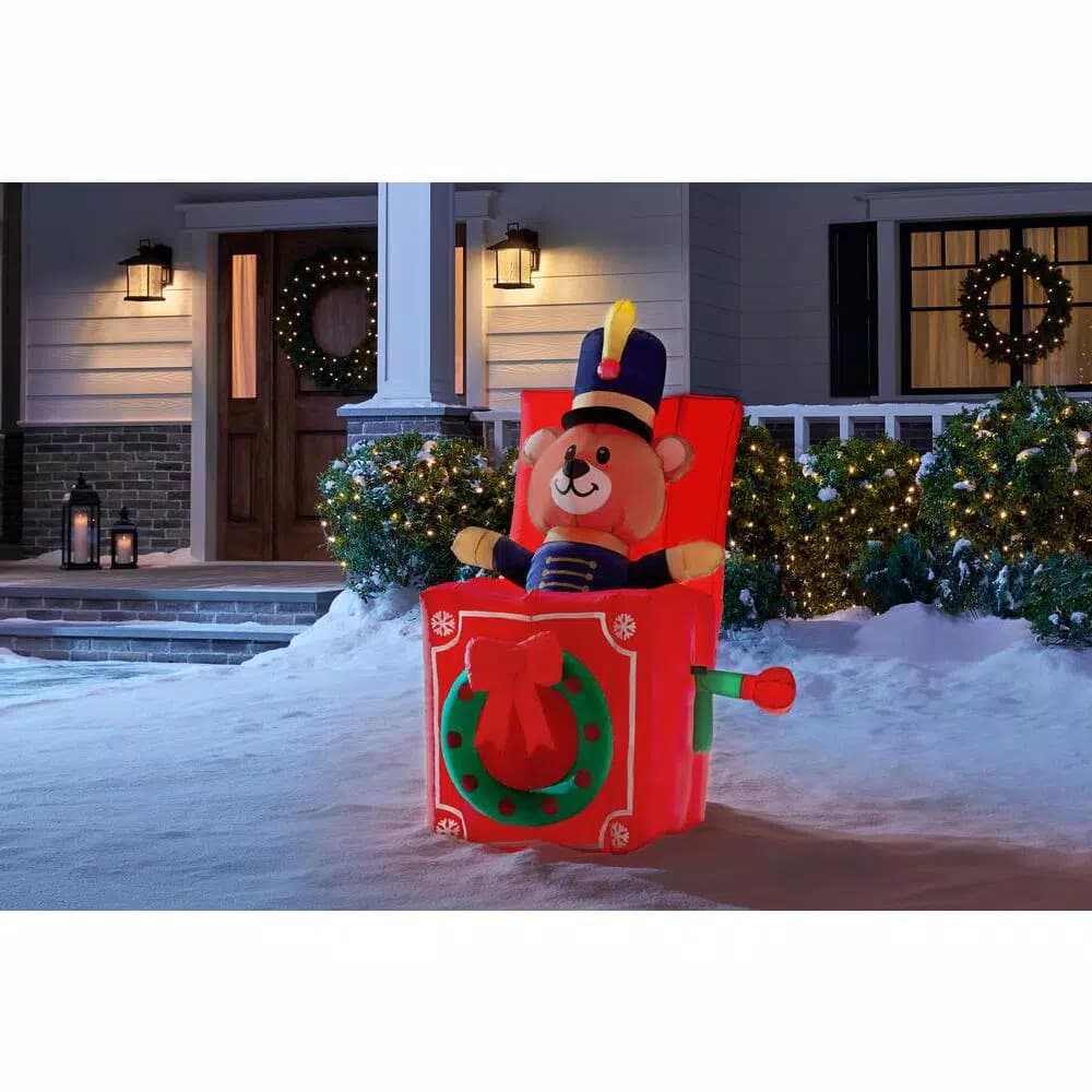 Home Accents Holiday 5 ft. Animated Airblown Inflatable Drum Major Bear in Jack-in-the-Box Christmas Decoration