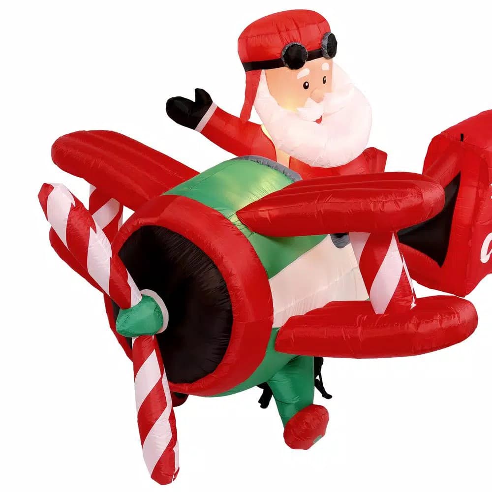 Home Accents Holiday 16 ft. Airblown Inflatable Santa on Airplane with Penguin and Merry Christmas Banner