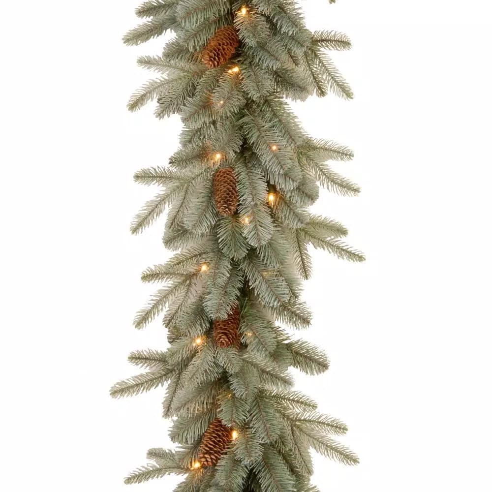 Unbranded 9 ft. Frosted Arctic Spruce Garland with 50 Clear Lights and Pine Cones